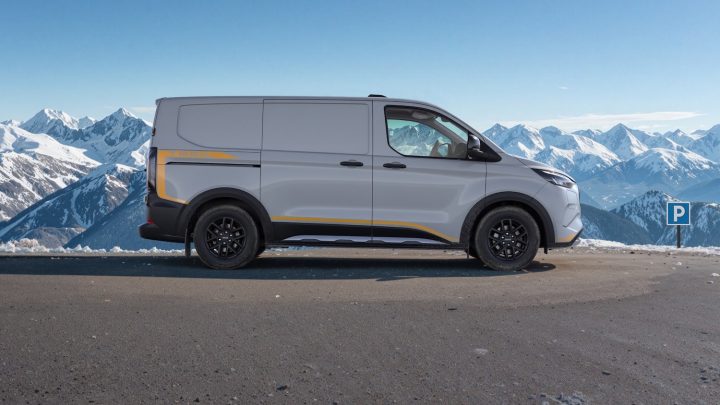 A photo showing the exterior of the Ford E-Transit Custom Trail AWD from a side angle.