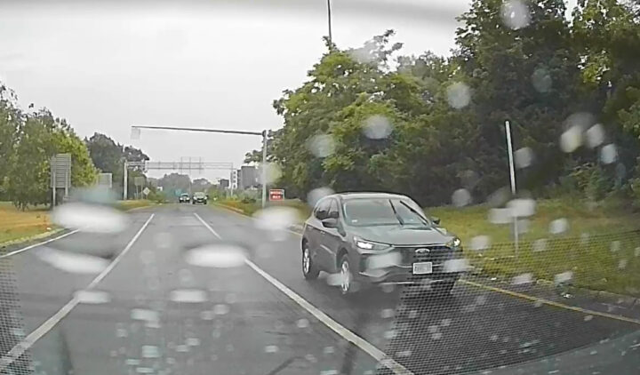 Video still of the Ford Escape stopped in the left turn lane with its left blinker on. They didn't end up turning left, oddly enough.