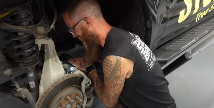 Video still of Zach, who owns the 2017 Ford F-150, removing the faulty wheel hub. After swapping it out, the pickup functioned perfectly again.