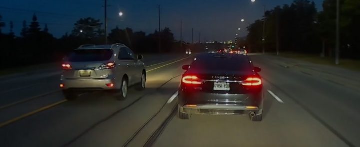 Video still of the Ford Fusion on the road, which attempted to cut off the cammer before drifting into another motorist's lane and causing them to have to swing wide.