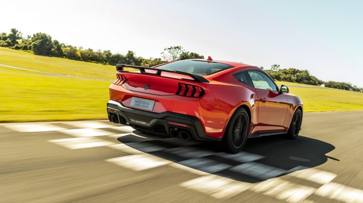 A photo showing the exterior of the South American Ford Mustang Dark Horse from a rear three quarters angle.