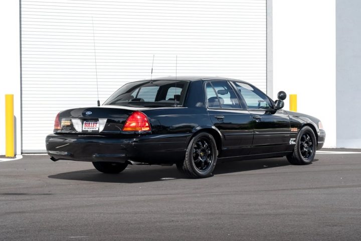 A photo showing the exterior of a supercharged Kenny Brown 1998 Ford Crown Victoria from a rear three quarters angle.