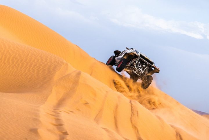 A photo showing the exterior of the updated Ford Raptor T1+ racer from a rear three quarters angle.