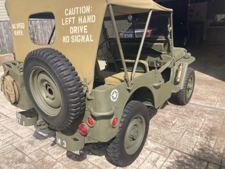 A photo showing the exterior of a 1942 Ford Jeep GPW from a rear three quarters angle.