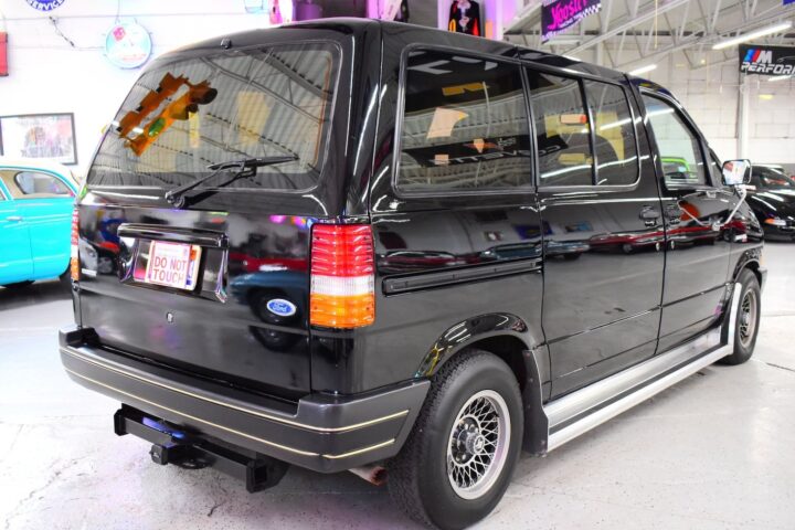 A photo showing the exterior of a 1986 Ford Aerostar van from a rear three quarters angle.