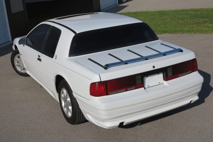 A photo showing the exterior of a 1989 Mercury Cougar XR-7 from a rear three quarters angle.