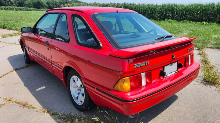 A photo showing the exterior of a 1989 Merkur XR4Ti coupe from a rear three quarters angle.