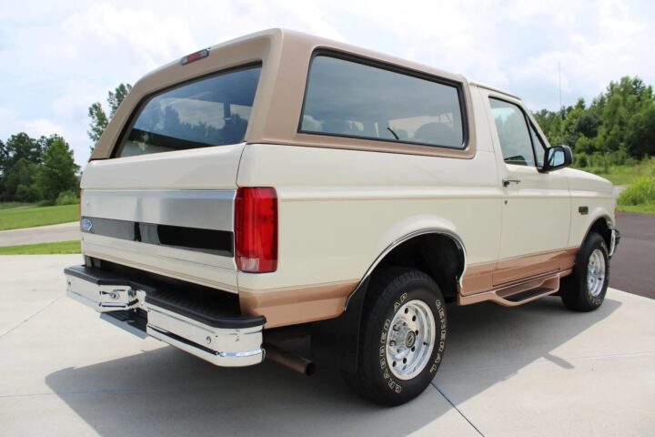 A photo showing the exterior of a 1995 Ford Bronco Eddie Bauer from a rear three quarters angle.