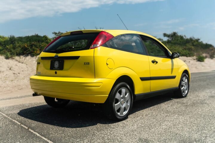 A photo showing the exterior of a 2002 Ford Focus ZX3 hatchback from a rear three quarters angle.