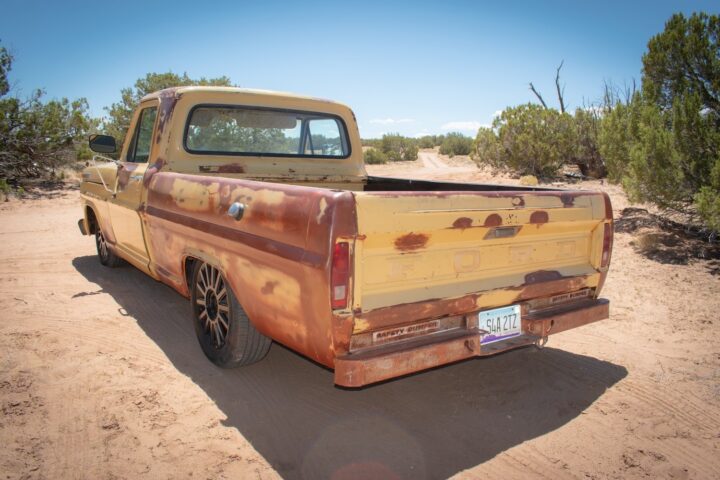 A photo showing the exterior of a 2005 Lincoln Town Car with a 1969 Ford F-100 body from a rear three quarters angle.