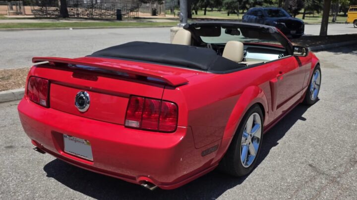A photo showing the exterior of a 2007 Ford Mustang GT convertible from a rear three quarters angle.