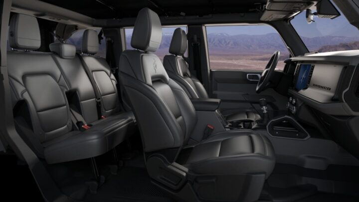 Photo showing the interior of the 2025 Ford Bronco Outer Banks with the Black Diamond Package, including the interior grab handle affixed to the center console on the passenger's side.