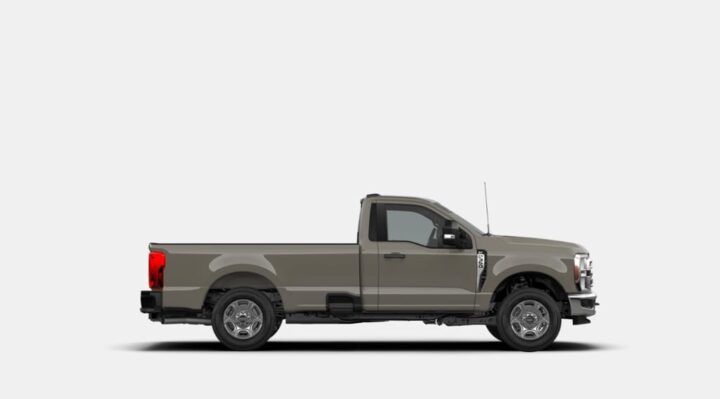 A photo of the 2026 Ford Super Duty from a side angle, showing the pickup in Marsh Gray, a new hue for the 2026 model year