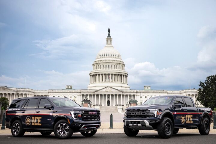 A photo showing the exterior of a Ford F-150 Raptor and GMC Yukon from a front three quarters angle.
