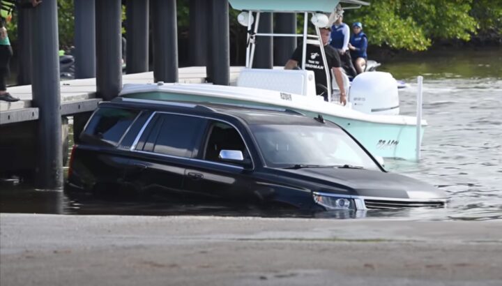 A photo showing the exterior of a Chevy Suburban saved by a Ford Super Duty from a front three quarters angle.