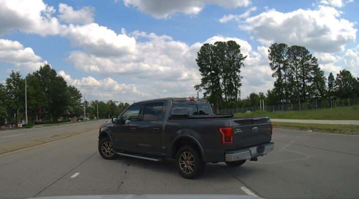 Video still of the Ford F-150 parked in the center of the intersection, right before they hit another motorist. 