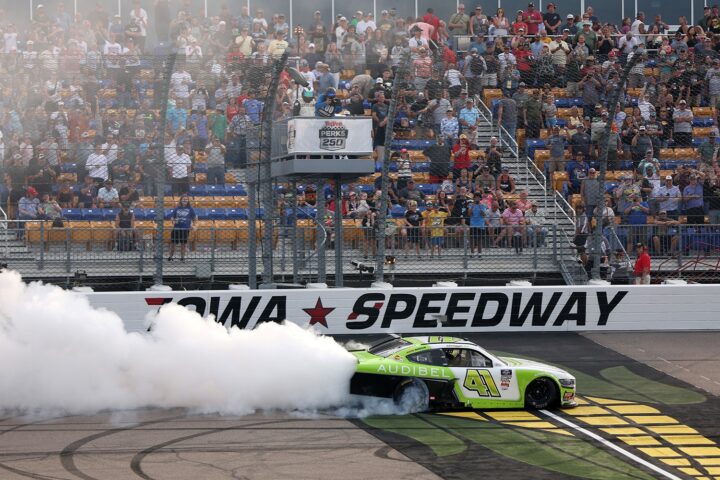 Photo showing Sam Mayer, driver of the No. 41 NASCAR Ford Mustang Dark Horse, celebrating his Iowa win. It's the first victory for the new Haas Factory Team.