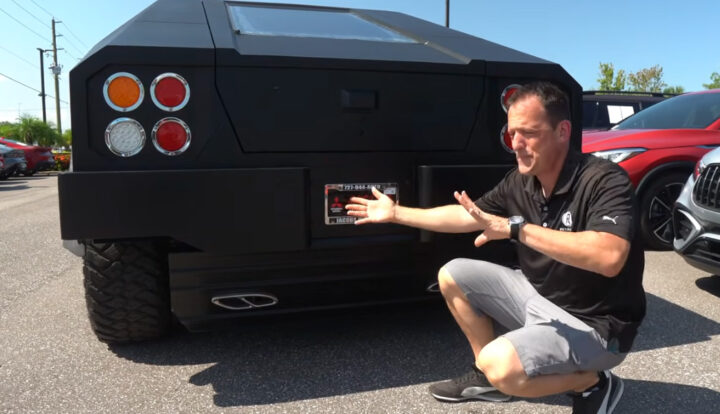 Video still of Joe Raiti showing off the Ford F-150 based USSV Hamba, which is a heavily armored, military style off-road vehicle. 