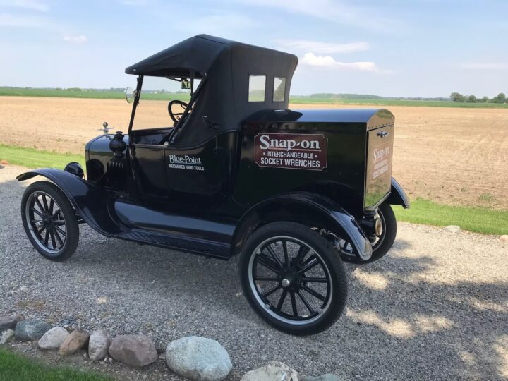 A photo showing the exterior of a 1925 Ford Model T cargo truck from a rear three quarters angle.