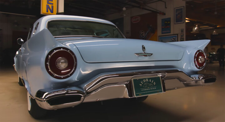 Video still of the 1957 Ford Thunderbird borrowed by Jay Leno to discuss its depreciating value, pictured from a rear three-quarters angle. It's still worth six figures, though. 