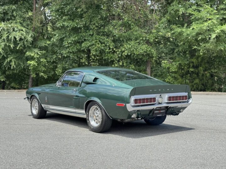 A photo showing the exterior of a 1968 Ford Mustang GT500KR from rear three quarters angle.