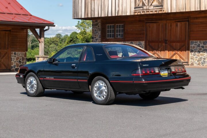 A photo showing the exterior of a 1988 Ford Thunderbird Turbo Coupe from a rear three quarters angle.