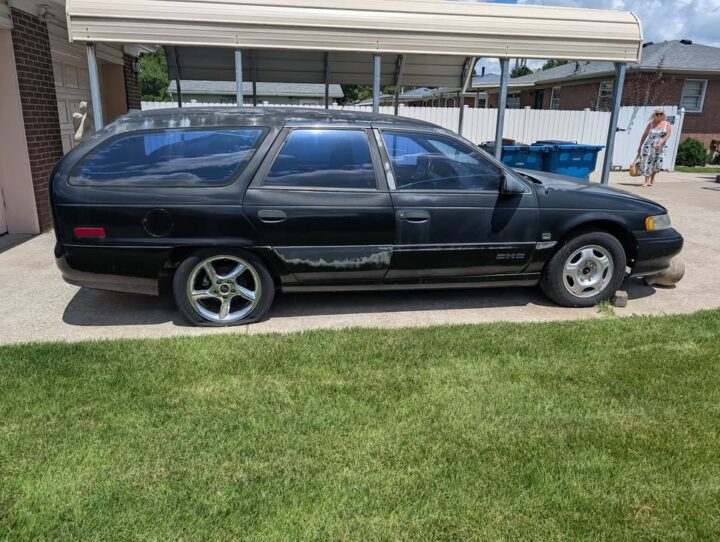 A photo showing the exterior of a 1993 Ford Taurus SHO wagon conversion from a side angle.