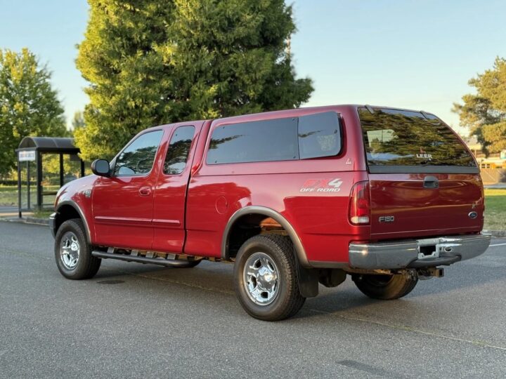 A photo showing the exterior of a 2002 Ford F-150 from a rear three quarters angle.
