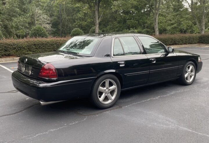 A photo showing the exterior of a 2003 Mercury Marauder from a rear three quarters angle.