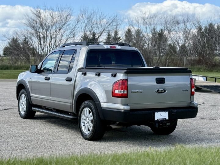 A photo showing the exterior of a 2008 Ford Explorer Sport Trac from a rear three quarters angle.
