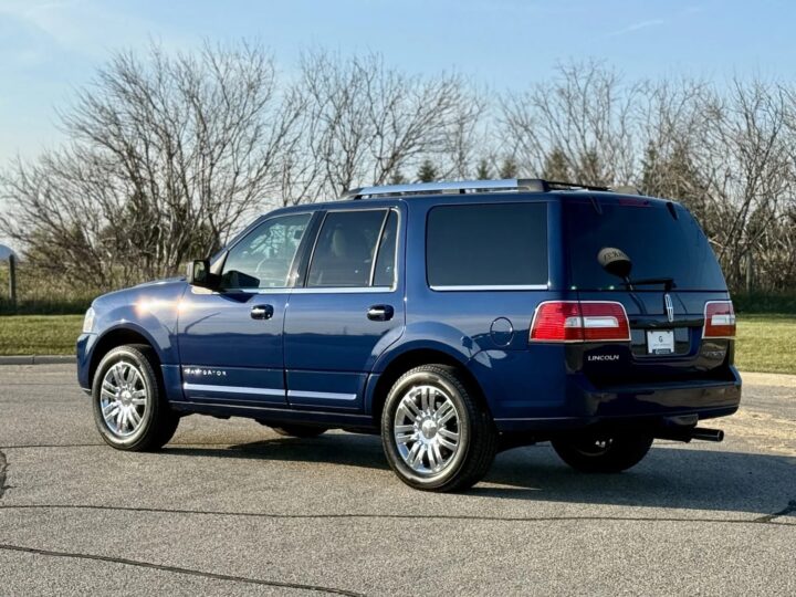 A photo showing the exterior of a 2010 Lincoln Navigator from a rear three quarters angle.