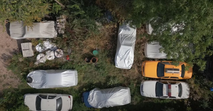 Video still of the Ford Crown Victoria collection, seen from a top-down angle. The collector kept them in surprisingly good shape. 
