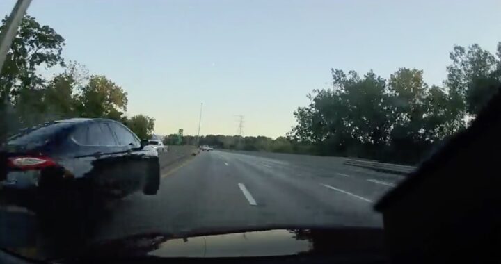 A photo showing the exterior of a Ford Fusion from a rear angle.