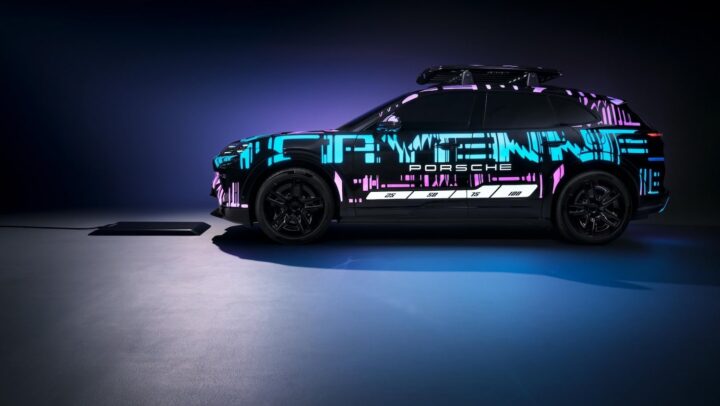 A photo showing the exterior of the Porsche Cayenne EV and wireless charging system from a side angle.