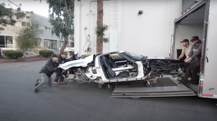 A photo showing the exterior of a wrecked 2005 Ford GT from a side angle.