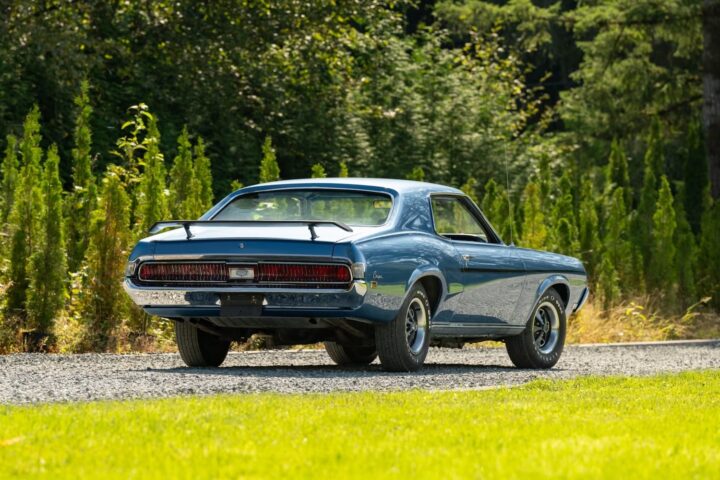 A photo showing the exterior of a 1969 Mercury Cougar from a rear three quarters angle.