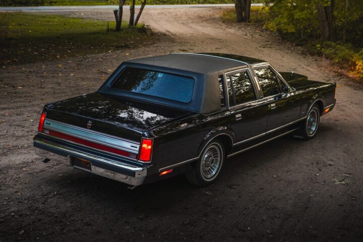 A photo showing the exterior of a 1988 Lincoln Town Car from a rear three quarters angle.