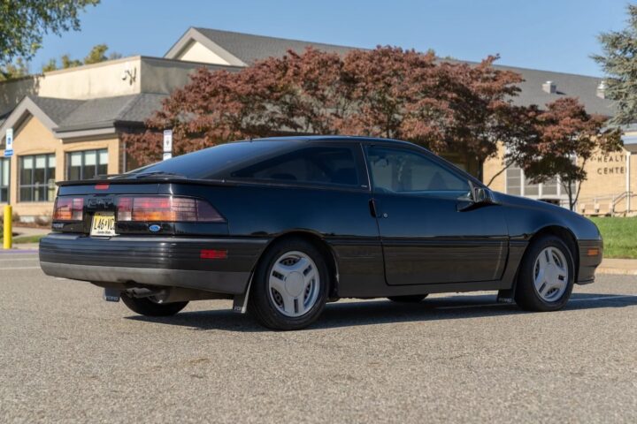 A photo showing the exterior of a 1989 Ford Probe GT from a rear three quarters angle.