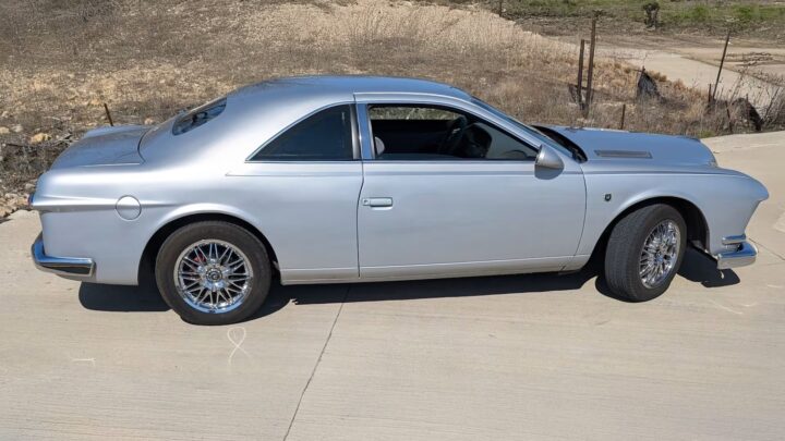 A photo showing the exterior of a 1995 Ford Thunderbird EasyRods conversion from a side angle.