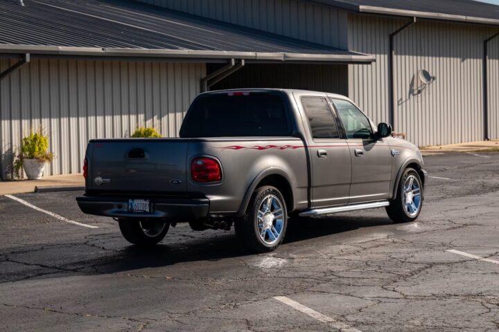 A photo showing the exterior of a 2002 Ford F-150 Harley-Davidson Edition from a rear three quarters angle.