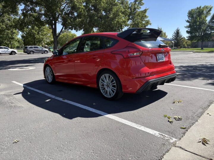A photo showing the exterior of a 2018 Ford Focus RS from a rear three quarters angle.