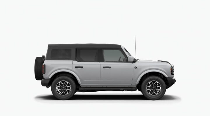 A photo of the 2026 Ford Bronco from a side view, wearing the new Avalanche color, one of two new hues offered on the SUV. 