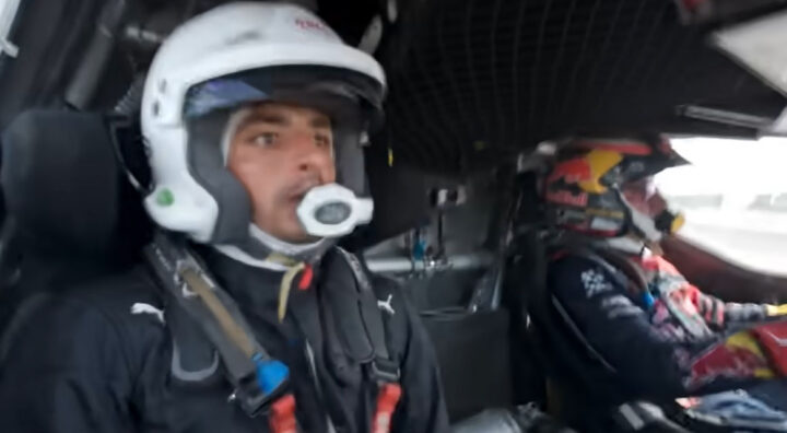 Video still of Carlos Sainz Jr. riding alongside his father, Carlos Sainz Sr., in the Ford Raptor T1+. Safe to say, he looks downright terrified. 