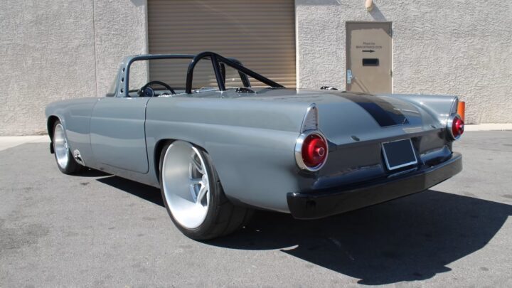 A photo showing the exterior of a custom 1955 Ford Thunderbird from a rear three quarters angle.