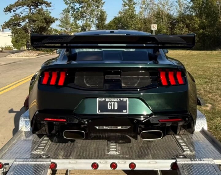 A photo of the Ford Mustang GTD in Highland Green, the same color that was seen on the Bullitt Mustang. It's pictured from the rear. 