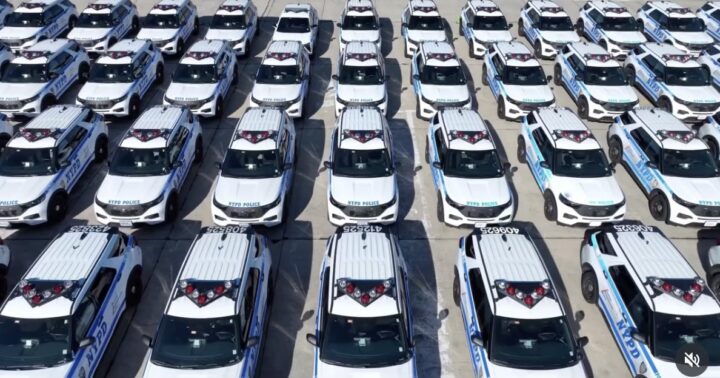 A photo showing a fleet of Ford Police Interceptor Utility SUVs from a front angle.