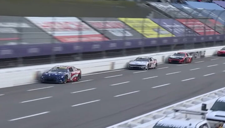 A video still of the No. 24 Chevy of William Byron out in front of the NASCAR Ford of Ryan Blaney in the closing laps at Martinsville. Their fight eliminated Ford's chance of winning the 2025 championship.