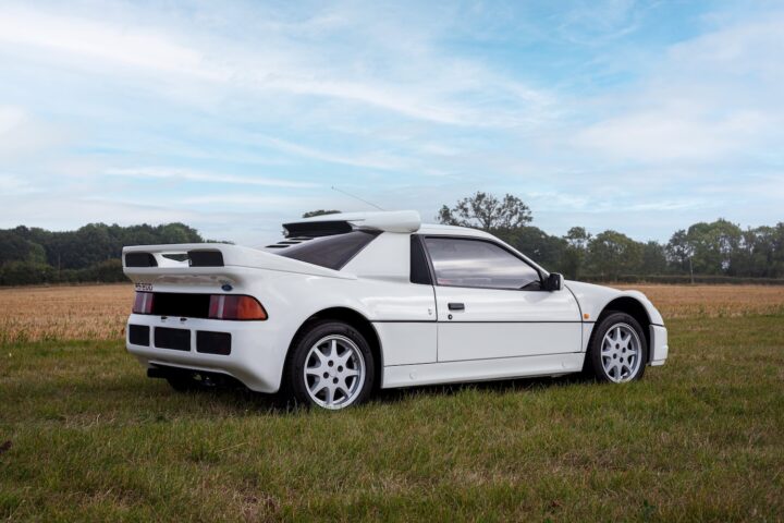 A photo showing the exterior of a Ford RS200 from a rear three quarters angle.